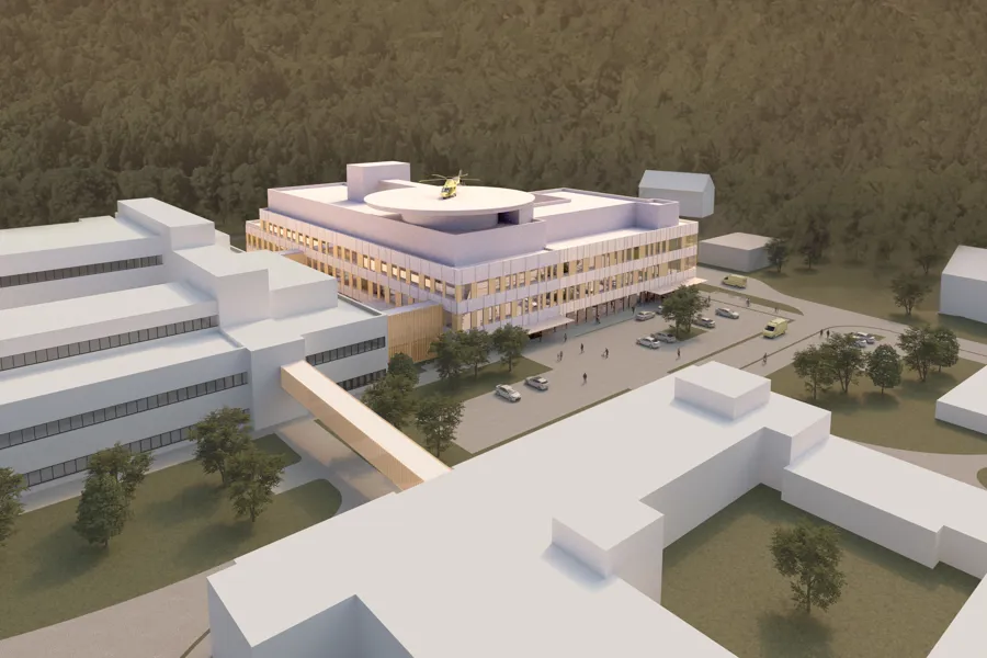 En bygning med en høyde i bakgrunnen