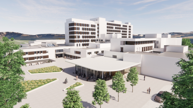 En stor hvit bygning med gårdsplass